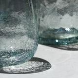Vasos bajo de vidrio soplado transparente con base craquelada
